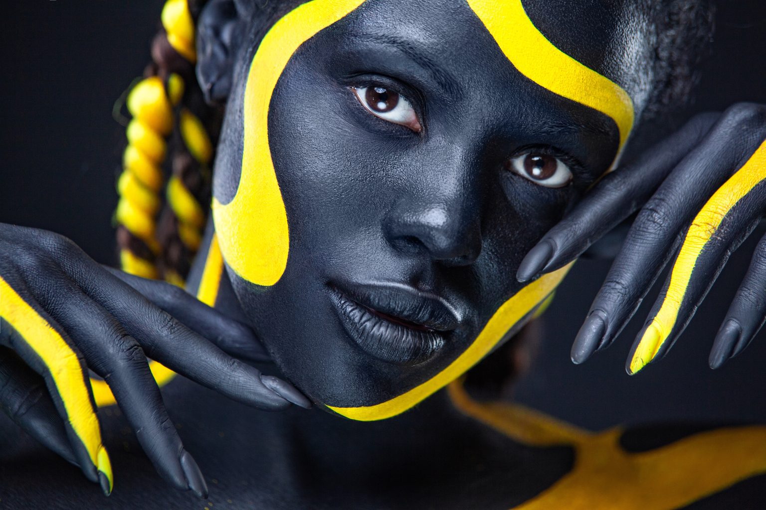 The,Art,Face.,Close-up,Portrait.,Black,And,Yellow,Body,Paint